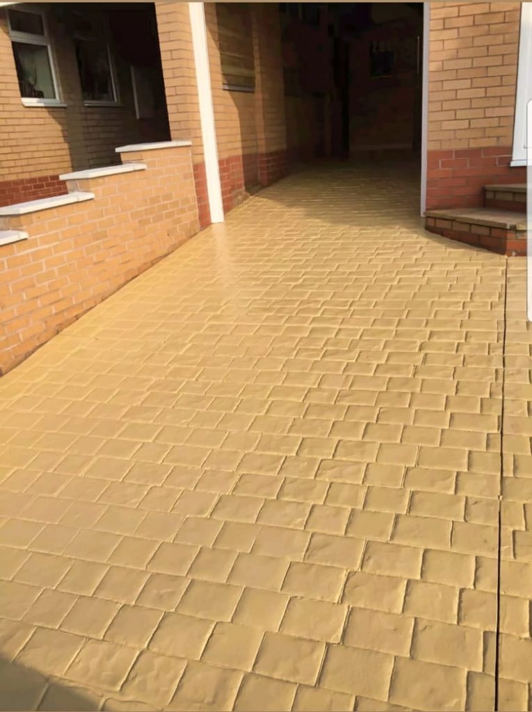 yellow concrete driveway